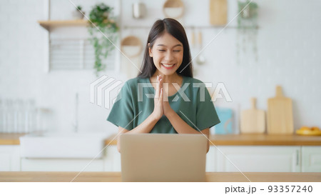Funny euphoric young asian woman celebrating winning Funny euphoric young asian woman celebrating winning 93357240