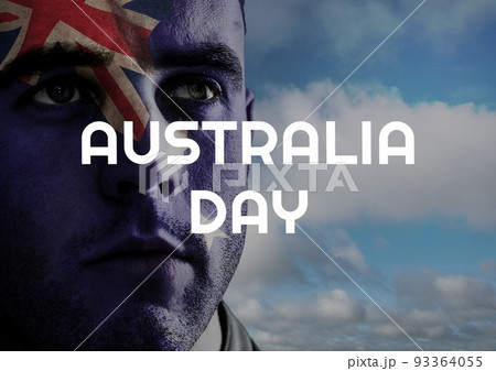 Composition of australia day text over caucasian man with flag of australia and sky with clouds 93364055