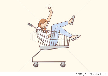 Smiling woman riding in supermarket cart  93367109