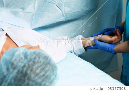 Female patient in operating room at hospital, ready to cesarean section Female patient in operating room at hospital, ready to cesarean section 93377508