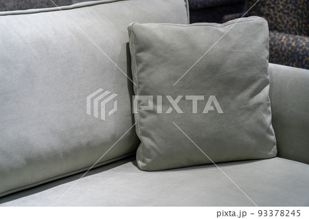 Close-up of grey cushion on cozy sofa. Pillow on a casual couch in living room Close-up of grey cushion on cozy sofa. Pillow on a casual couch in living room 93378245