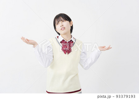 白背景でギブアップする女子高生 93379193