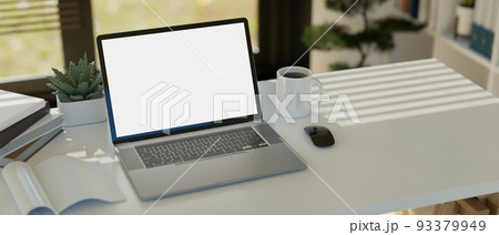 Notebook laptop white screen mockup on white table. Modern office desk workspace Notebook laptop white screen mockup on white table. Modern office desk workspace 93379949