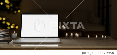 Workspace tabletop with laptop mockup and copy space over the dark office in the background Workspace tabletop with laptop mockup and copy space over the dark office in the background 93379950