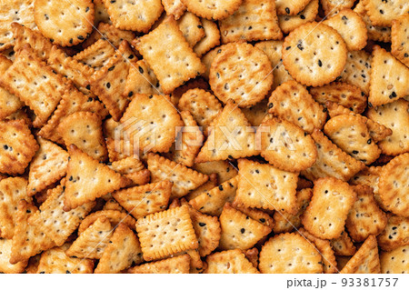 Saltine cracker background. Texture of salty crackers. Saltine cracker background. Texture of salty crackers. 93381757