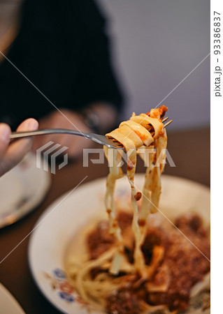 woman hand holding pasta woman hand holding pasta 93386837