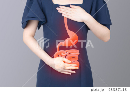 Woman suffering from stomachache and acid reflux symptoms with gastrointestinal tract anatomy on gray background. Cause of abdominal pain such as GERD, IBS, peptic ulcer or stomach cancer. Woman suffering from stomachache and acid reflux symptoms with gastrointestinal tract anatomy on gray background. Cause of abdominal pain such as GERD, IBS, peptic ulcer or stomach cancer. 93387118