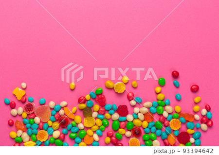 Colorful lollipops on a pink background 93394642