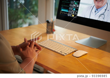 Closeup image of elderly woman video calling her doctor to tell her complaints and get prescription Closeup image of elderly woman video calling her doctor to tell her complaints and get prescription 93396985