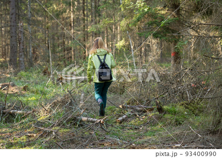 Woman play Geocaching. Walk in deep forest. 93400990