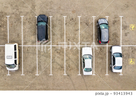 Top down aerial view of many cars on a parking lot of supermarket or on sale car dealer market. 93413943