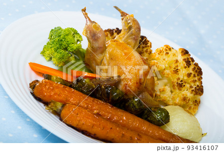 Grilled quail with baked vegetables in honey-mustard sauce Grilled quail with baked vegetables in honey-mustard sauce 93416107