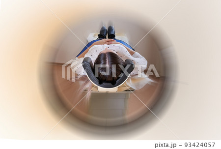 Female patient undergoing MRI - Magnetic resonance imaging in Hospital with motion blur effect 93424057