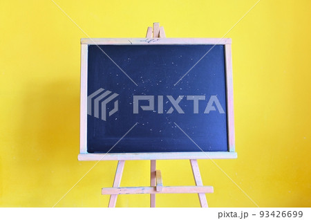 Blackboard - back to school. Concept for education and school on yellow background. 93426699