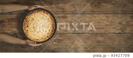 Cottage cheese casserole. Homemade cheese pie on a rustic wooden background. Home food concept. Cottage cheese casserole. Homemade cheese pie on a rustic wooden background. Home food concept. 93427709