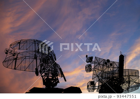 Air defense radars of military mobile anti aircraft systems, modern army industry on the background of the sunset orange sky, Russia Air defense radars of military mobile anti aircraft systems, modern army industry on the background of the sunset orange sky, Russia 93447551