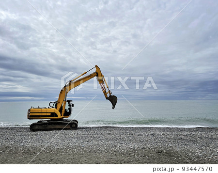 Excavator working on earthmoving at open pit mining  93447570