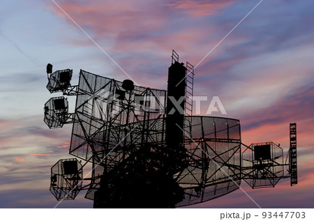 Air defense radars of military mobile anti aircraft systems, modern army industry on the background of the sunset orange sky, Russia Air defense radars of military mobile anti aircraft systems, modern army industry on the background of the sunset orange sky, Russia 93447703