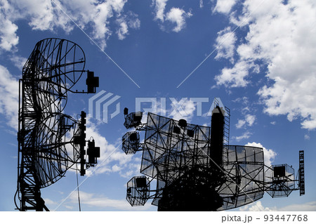 Air defense radars of military mobile anti aircraft systems, modern army industry on background beautiful clouds and sky, Russia 93447768
