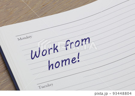 Work from home diary reminder appointment open on desk 93448804