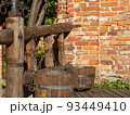 wooden buckets next to the wall 93449410