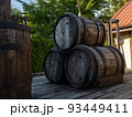 three wooden barrels on the deck 93449411