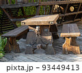 Wooden table and two long benches 93449413