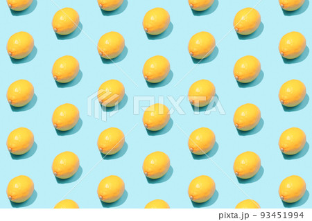 Summer background of yellow lemons on a mint table. 93451994