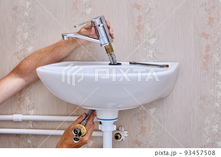 Faulty water faucet disconnected from water supply to repair leak. 93457508
