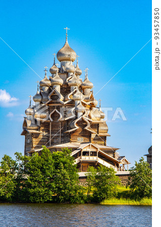 View to old monastery Kizhi Pogost, wooden Temple and Churchyard. Church of Transfiguration, bell tower in summer at sunset. Natural ecological clean island in Onega lake, Republic of Karelia, Russia 93457850