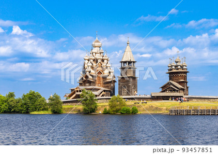 View to old monastery Kizhi Pogost, wooden Temple and Churchyard. Church of Transfiguration, bell tower in summer at sunset. Natural ecological clean island in Onega lake, Republic of Karelia, Russia 93457851