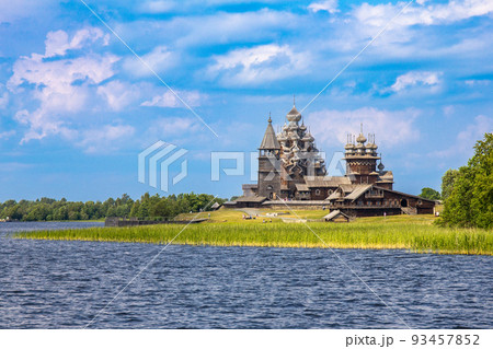 View to old monastery Kizhi Pogost, wooden Temple and Churchyard. Church of Transfiguration, bell tower in summer at sunset. Natural ecological clean island in Onega lake, Republic of Karelia, Russia 93457852