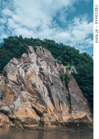 Large rock with green forest around. Large rock with green forest around. 93461061