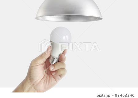 Closeup of hand to change LED bulbs Closeup of hand to change LED bulbs 93463240