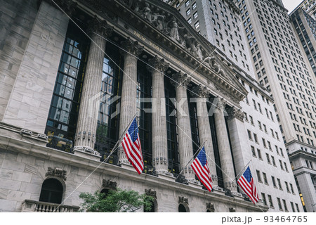 Front of the 1908 New York Stock Exchange on Broad Street with American flags on a front Front of the 1908 New York Stock Exchange on Broad Street with American flags on a front 93464765