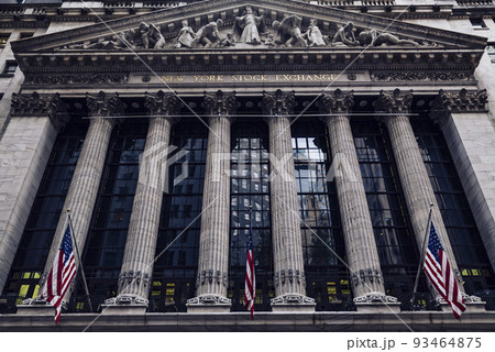 Front of the 1908 New York Stock Exchange on Broad Street with American flags on a front Front of the 1908 New York Stock Exchange on Broad Street with American flags on a front 93464875