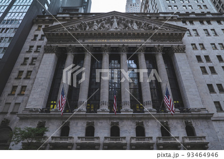 Front of the 1908 New York Stock Exchange on Broad Street with American flags on a front Front of the 1908 New York Stock Exchange on Broad Street with American flags on a front 93464946