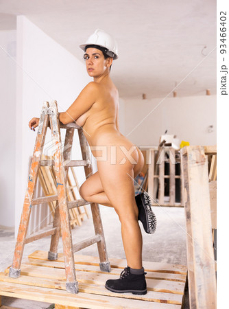 Naked woman posing in construction site Naked woman posing in construction site 93466402