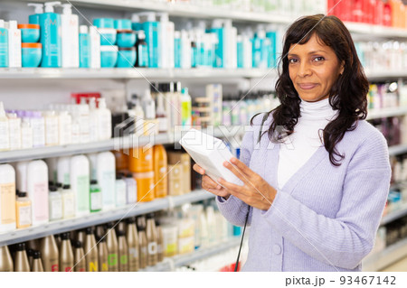 Female buying box with cosmetic in shop Female buying box with cosmetic in shop 93467142
