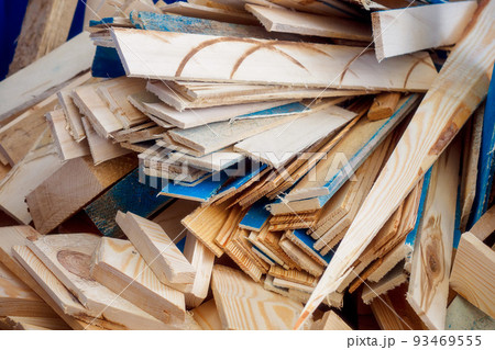 A pile of wood chips and wood waste for recycling. View from above. Recyclable materials. A pile of wood chips and wood waste for recycling. View from above. Recyclable materials. 93469555
