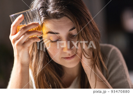 woman alcoholic drinking strong alcohol at home woman alcoholic drinking strong alcohol at home 93470880