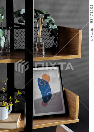 book shelf with art and home decor over black wall book shelf with art and home decor over black wall 93471531