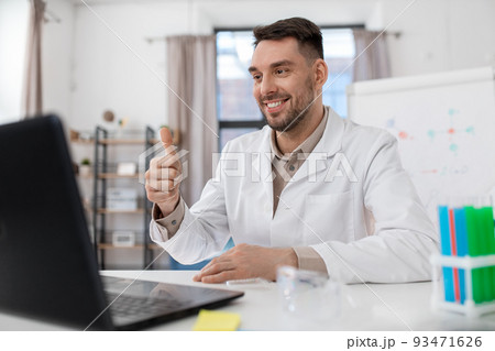 chemistry teacher with laptop having online class chemistry teacher with laptop having online class 93471626