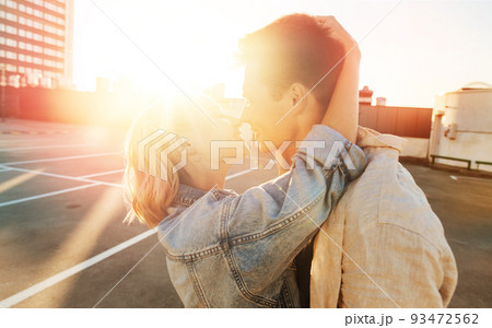 happy young couple on roof top city parking 93472562
