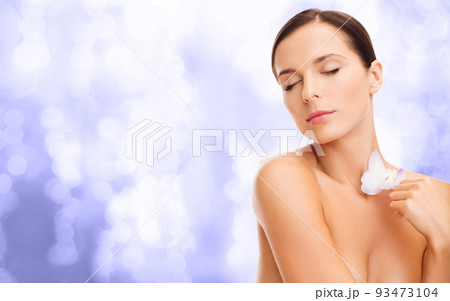 beautiful woman with orchid flower 93473104