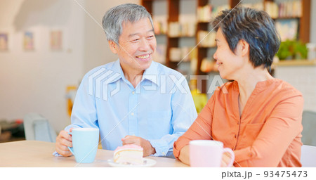 old couple drinking happily 93475473