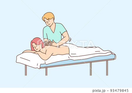 Therapist doing massage to female client  93479845