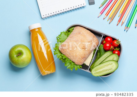 Lunch box with sandwich, vegetables and juice Lunch box with sandwich, vegetables and juice 93482335