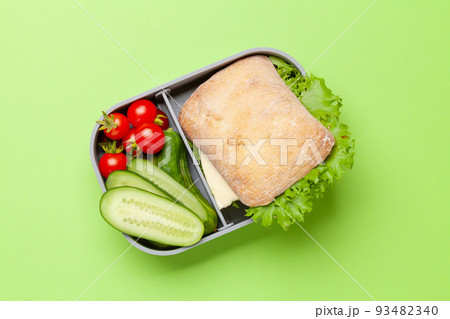 Lunch box with sandwich, vegetables and juice Lunch box with sandwich, vegetables and juice 93482340