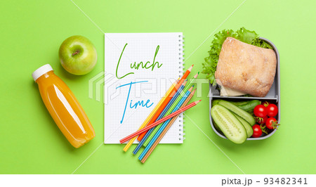 Lunch box with sandwich, vegetables and juice 93482341